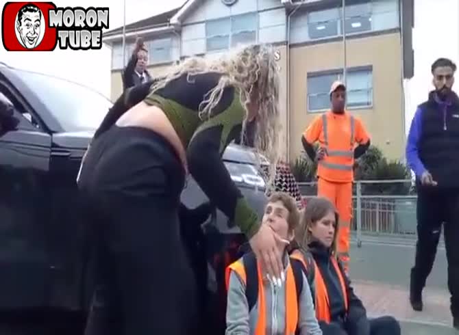 Video :She uses her vehicle to shove demonstrators as she drives her child to school